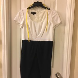 Like new; only worn once.  Zipper back, belted